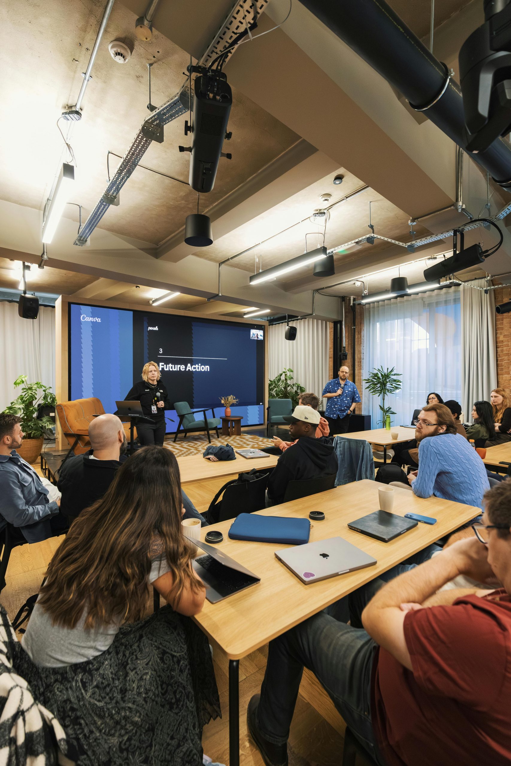 Dynamic workshop with diverse participants discussing future strategies in a modern space.